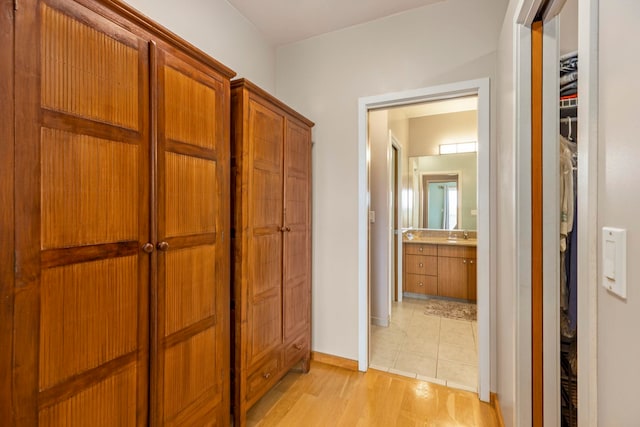 corridor featuring light hardwood / wood-style floors