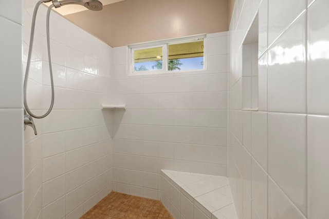 bathroom with tiled shower