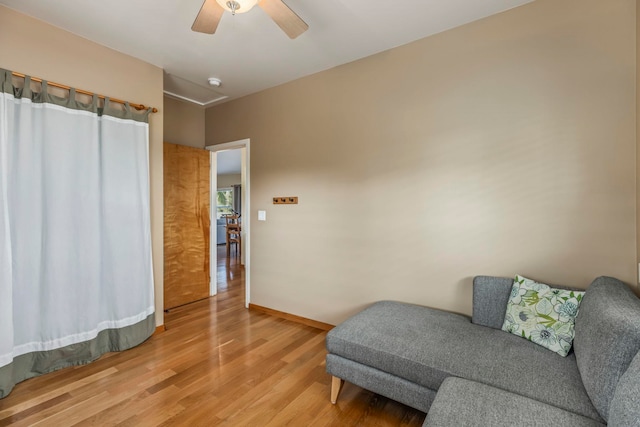 50 Uakoko Pl, Haiku, HI 96708 - living area featuring light wood finished floors, a ceiling fan, and baseboards