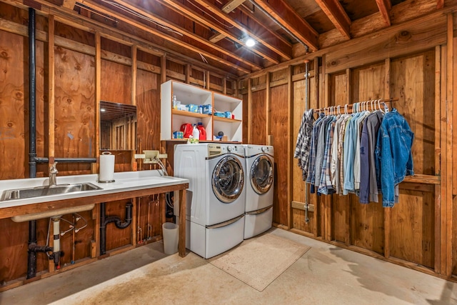 laundry area featuring washing machine and dryer and sink