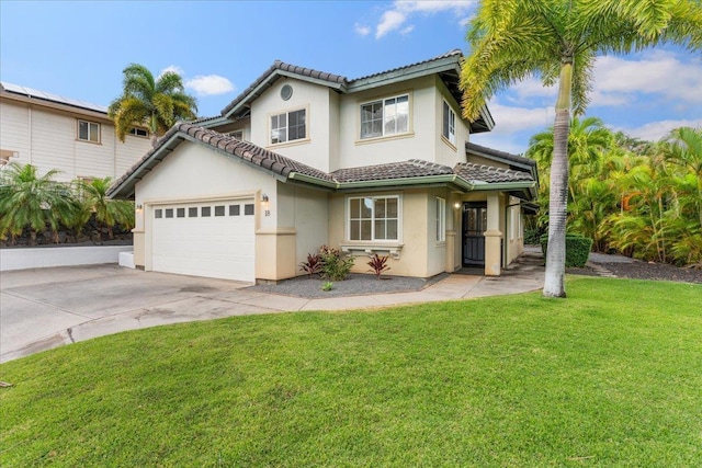 mediterranean / spanish-style house with a front yard and a garage