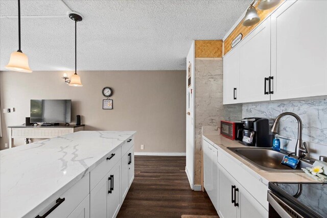 1993 S Kihei Rd Unit 308, Kihei, HI 96753 - kitchen featuring a textured ceiling, a sink, pendant lighting, white dishwasher, and backsplash