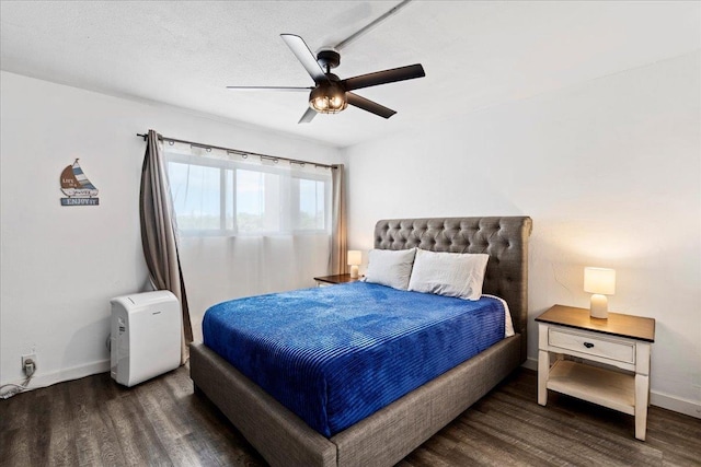 1993 S Kihei Rd Unit 308, Kihei, HI 96753 - bedroom featuring wood finished floors, baseboards, and ceiling fan