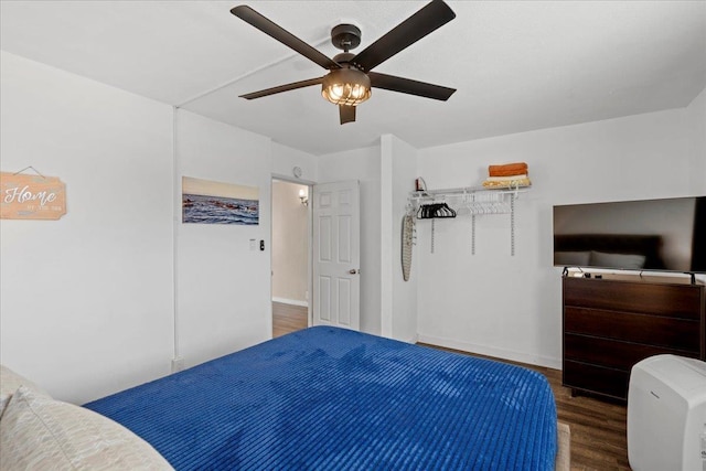 1993 S Kihei Rd Unit 308, Kihei, HI 96753 - bedroom featuring wood finished floors, ceiling fan, and baseboards