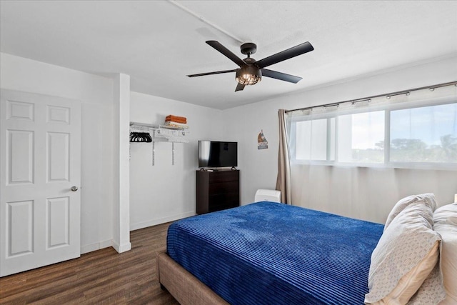 1993 S Kihei Rd Unit 308, Kihei, HI 96753 - bedroom featuring wood finished floors, baseboards, and a ceiling fan