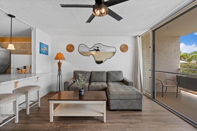 1993 S Kihei Rd Unit 308, Kihei, HI 96753 - living area with ceiling fan, wood finished floors, and a textured ceiling