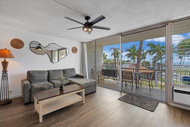 1993 S Kihei Rd Unit 308, Kihei, HI 96753 - living room with floor to ceiling windows, a textured ceiling, wood finished floors, and a ceiling fan