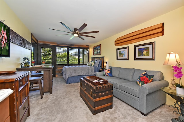 bedroom featuring ceiling fan and light colored carpet