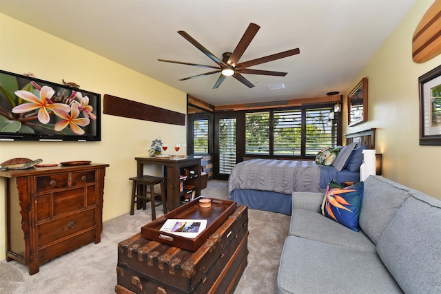 bedroom featuring ceiling fan and light carpet