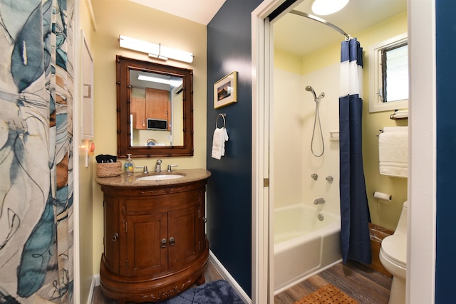 full bathroom featuring wood-type flooring, vanity, toilet, and shower / bath combo with shower curtain