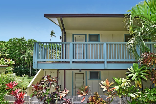 rear view of house featuring a balcony