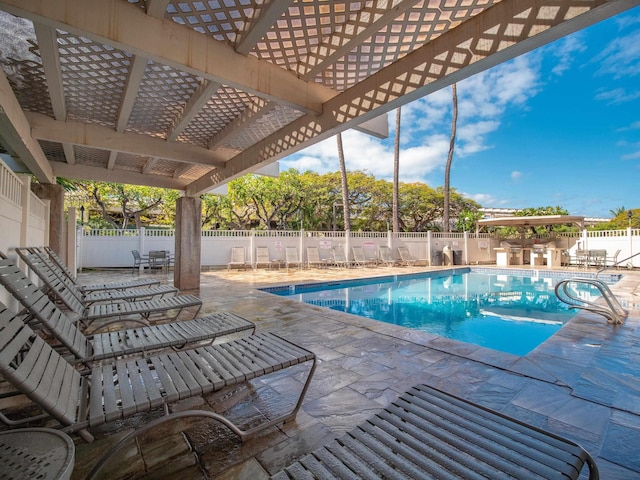 view of pool with a patio area and a pergola