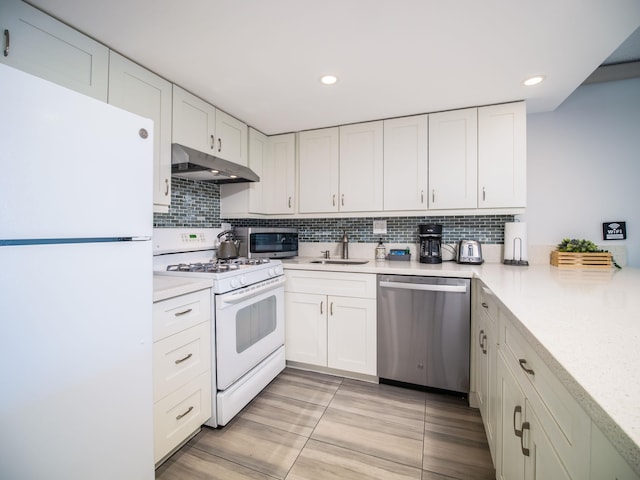 kitchen with white cabinets, sink, and stainless steel appliances