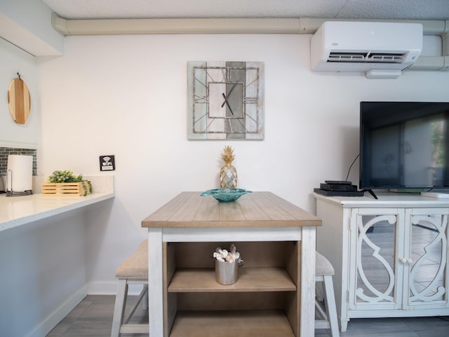 dining space featuring a wall mounted AC