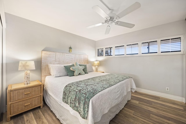 bedroom featuring ceiling fan and dark wood-type flooring