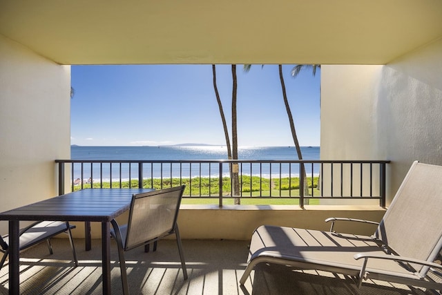 balcony featuring a water view