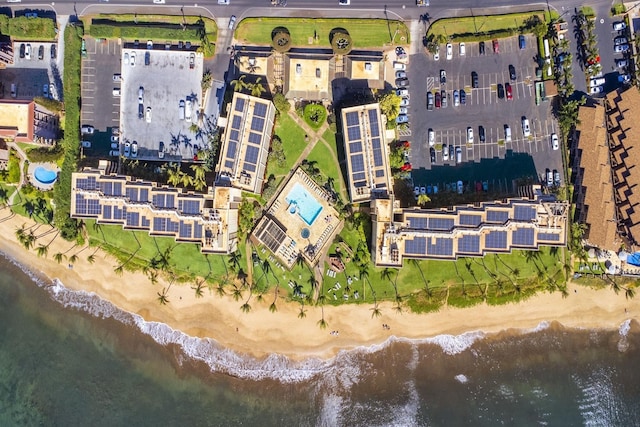 bird's eye view with a beach view and a water view