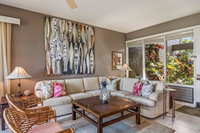 living room with ceiling fan and light tile patterned flooring