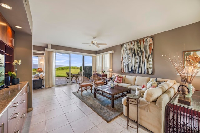 tiled living room with ceiling fan