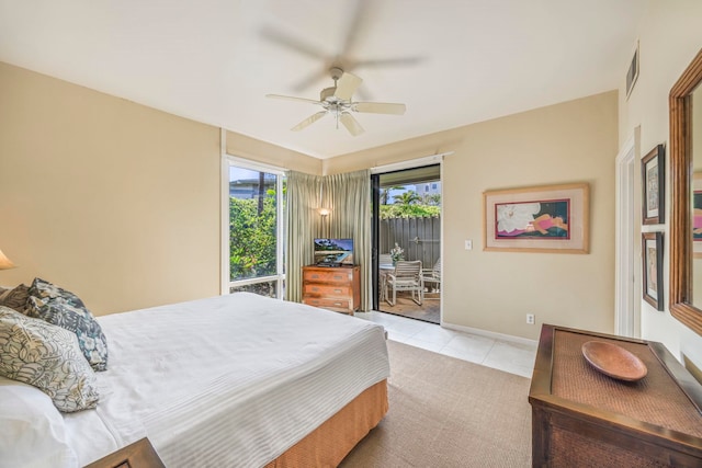 bedroom with ceiling fan and light tile patterned floors