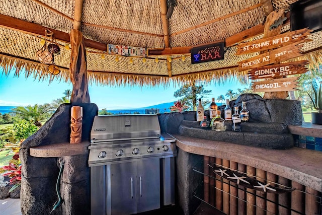 view of patio / terrace featuring area for grilling and a grill