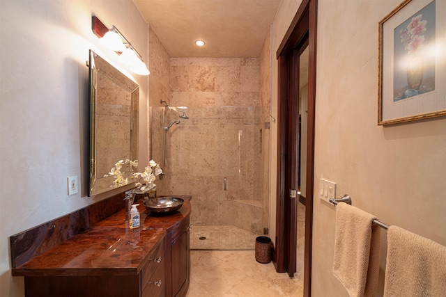 bathroom featuring vanity and a tile shower