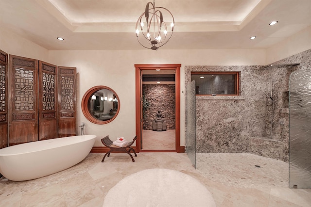 bathroom featuring a raised ceiling, independent shower and bath, and a notable chandelier