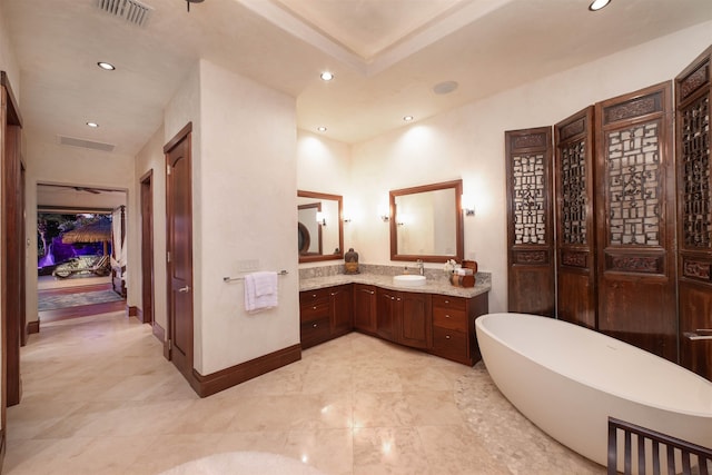 bathroom featuring vanity and a bathing tub