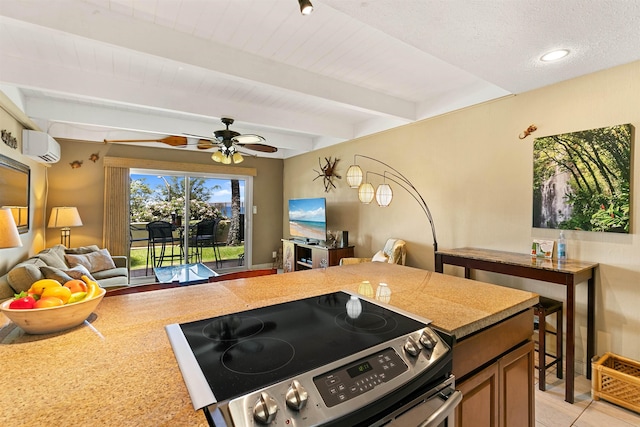 kitchen featuring electric stove, ceiling fan, light tile patterned floors, beamed ceiling, and a wall unit AC