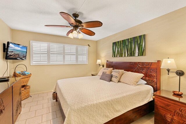 tiled bedroom with ceiling fan