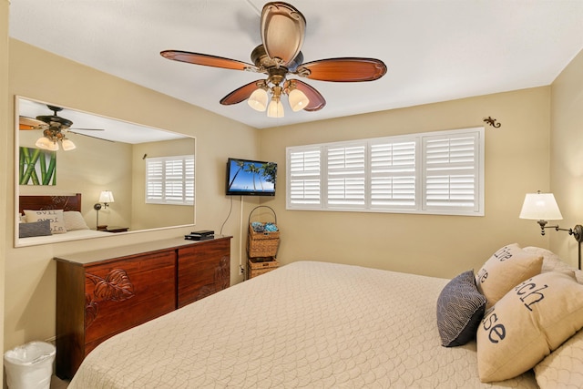 bedroom featuring ceiling fan and multiple windows