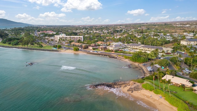 birds eye view of property with a beach view and a water view