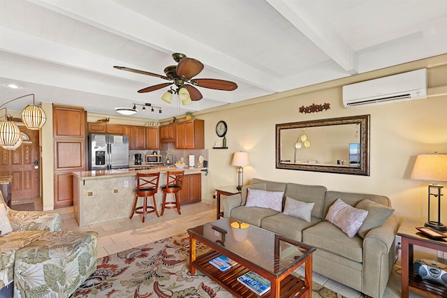 tiled living room featuring ceiling fan, sink, beamed ceiling, and a wall mounted air conditioner