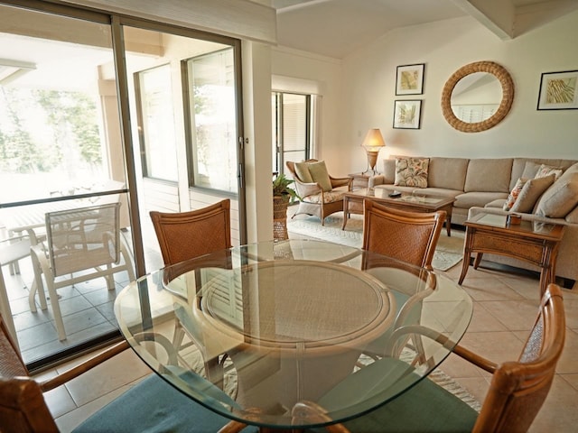 dining space with a wealth of natural light and light tile floors