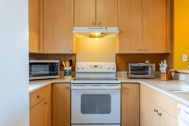 kitchen featuring dishwashing machine, sink, and white electric range