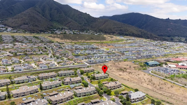 birds eye view of property featuring a mountain view