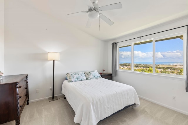 carpeted bedroom featuring vaulted ceiling and ceiling fan