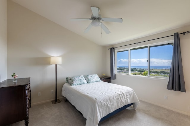 carpeted bedroom with ceiling fan and lofted ceiling