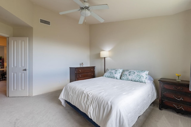 bedroom featuring ceiling fan and light carpet