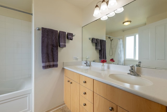 bathroom with tile patterned flooring, shower / bath combo, and vanity