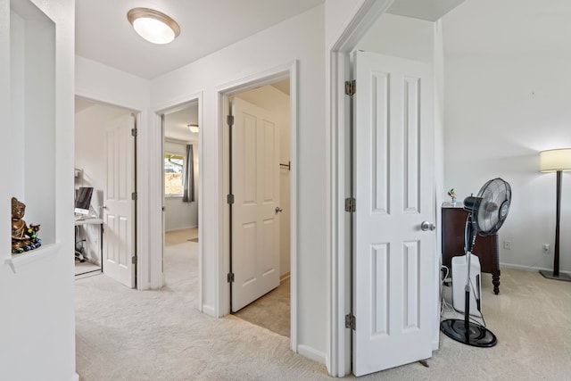 hallway with light carpet