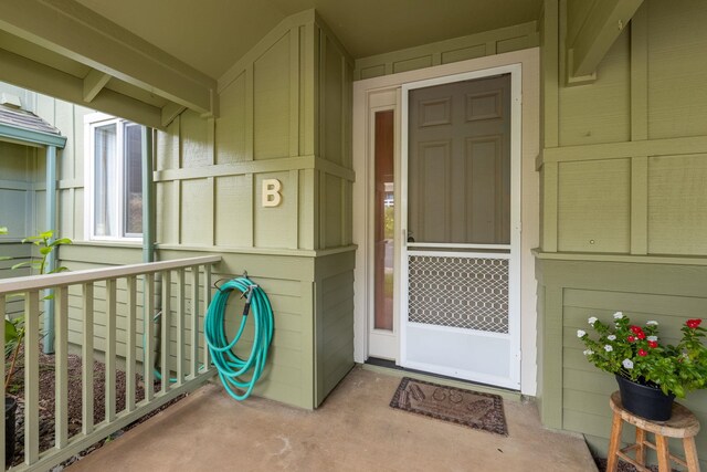 doorway to property with a porch