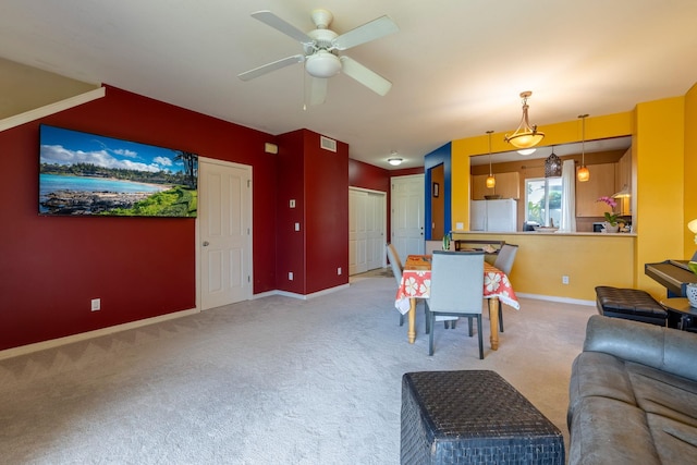 interior space with carpet and ceiling fan