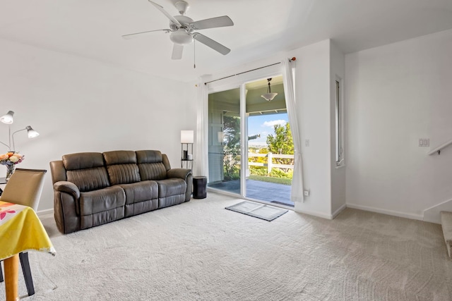 living room with light carpet and ceiling fan