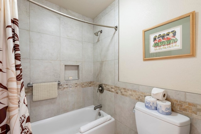 bathroom with toilet and shower / tub combo with curtain