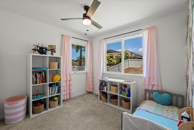 carpeted bedroom with a ceiling fan