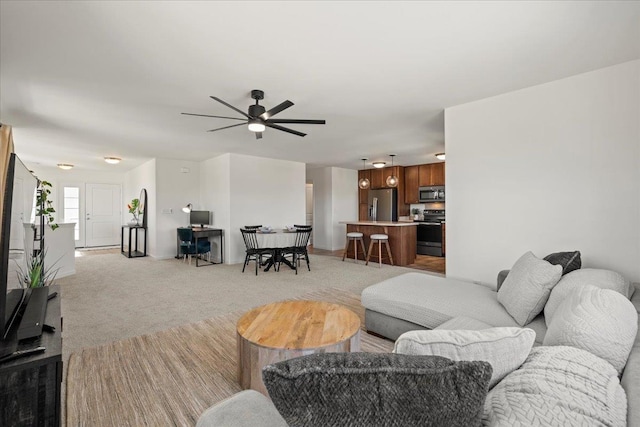 living room featuring ceiling fan and light carpet