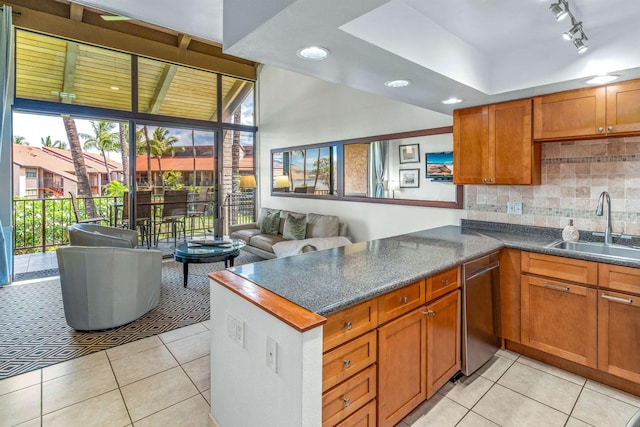 940 S Kihei Rd Unit C304, Kihei, HI 96753 - kitchen with stainless steel dishwasher, light tile patterned floors, backsplash, dark countertops, and recessed lighting
