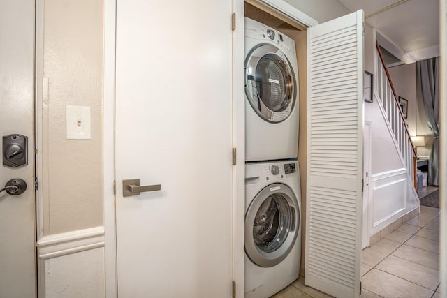940 S Kihei Rd Unit C304, Kihei, HI 96753 - laundry room featuring stacked washing machine and dryer and light tile patterned floors
