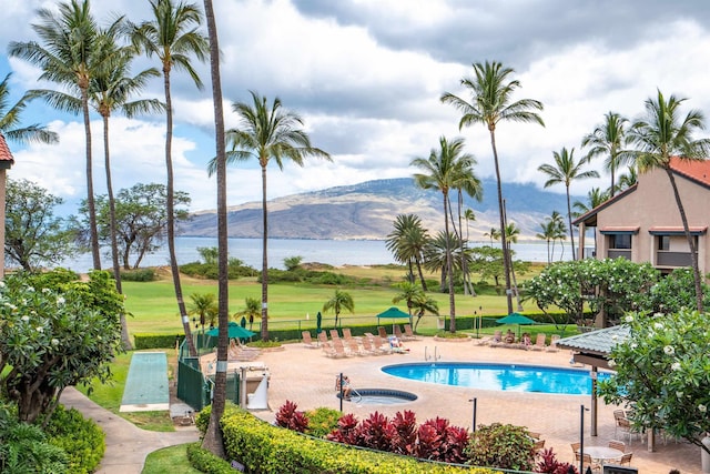 940 S Kihei Rd Unit C304, Kihei, HI 96753 - community pool featuring a water and mountain view and a patio area